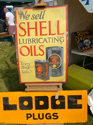 Lodge Plugs We Sell Lubricating Oils Sign - Aquitania Collectables